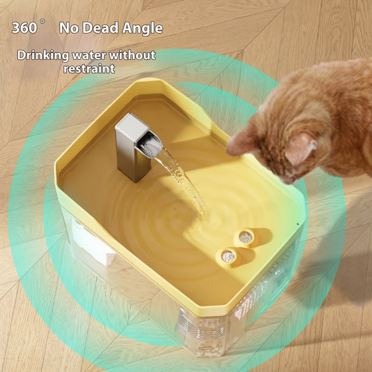 A cat drinking water from a modern square pet fountain with a yellow top tray, clear base, and metal spout, shown on a wood floor with a teal circular graphic and text reading '360° No Dead Angle Drinking water without restraint.'.