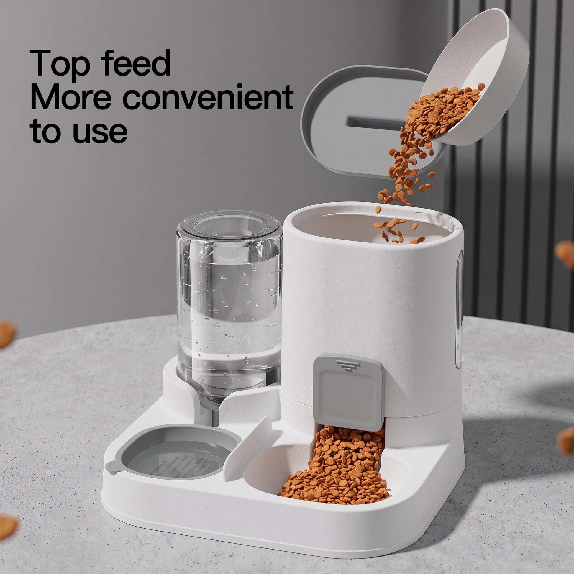 A white automatic pet feeder and water dispenser set on a light gray countertop. Kibble is shown being poured into the feeder from an open lid above, and water is visible in the glass reservoir.